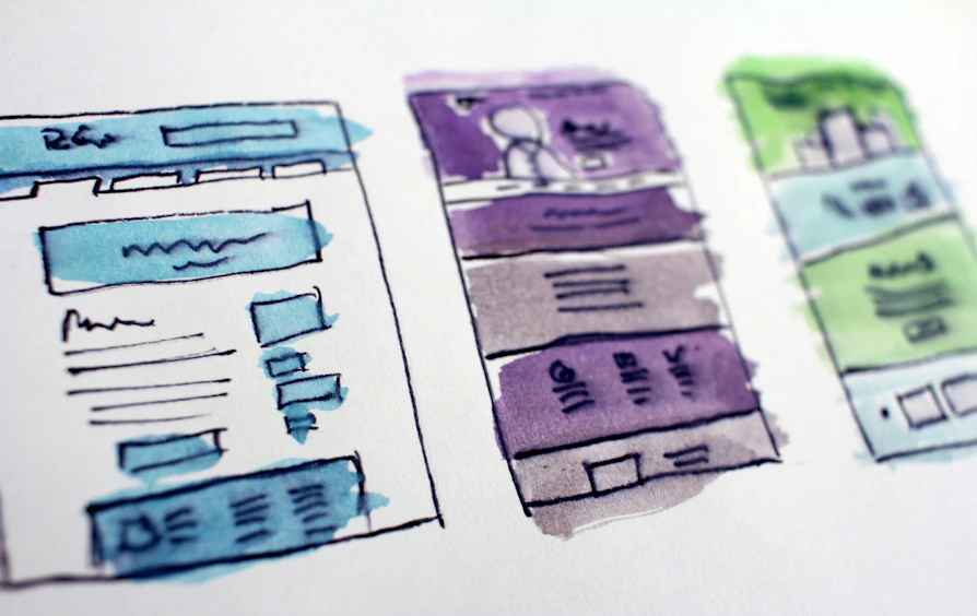 Hand-drawn wireframes of page layouts, sketched during a discovery workshop