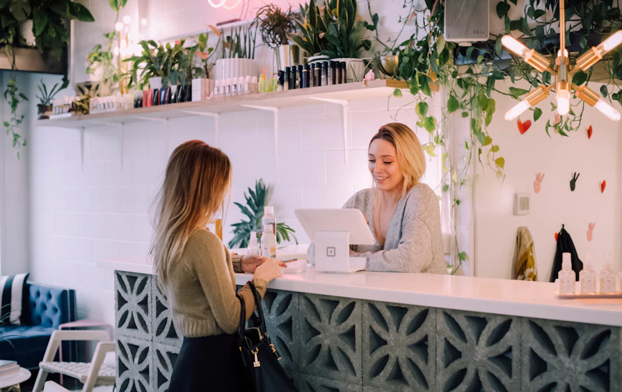 Staff checking a visitor out at the counter